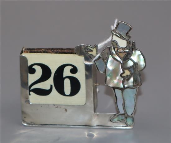 A George V silver, mother of pearl and ivory desk calendar, London, 1931, 7.2cm.
